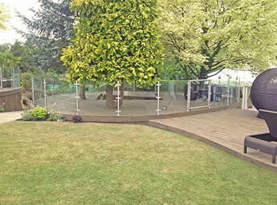 AB Sundecks Decking and Steel Glass surrounding trees and hot tub