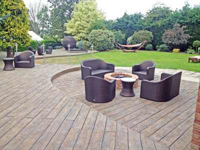 AB Sundecks Decking and Picket Glass in garden surrounding trees with Hot Tub in center